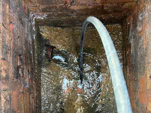 Using High-Pressure Water Jetting to Clear Drain Silt Build-Up in Brentford