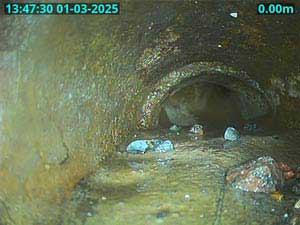 Hardened scale build which causes recurring blocked drains.